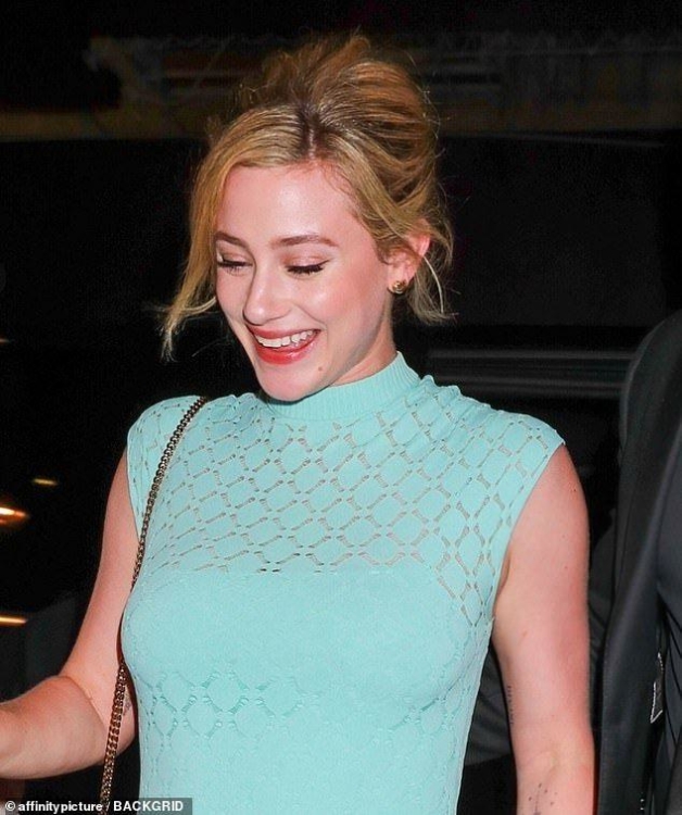 Lili-Reinhart-bares-average-sized-arms-in-sleeveless-dress-in-Paris